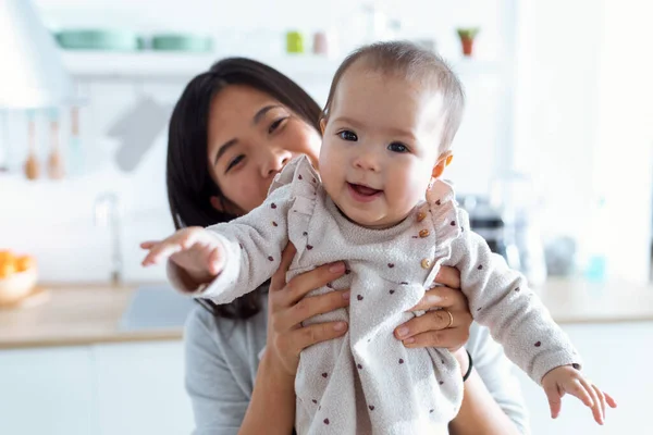 Shot Happy Young Mother Her Baby Daughter Looking Camera Kitchen — Stock Photo, Image