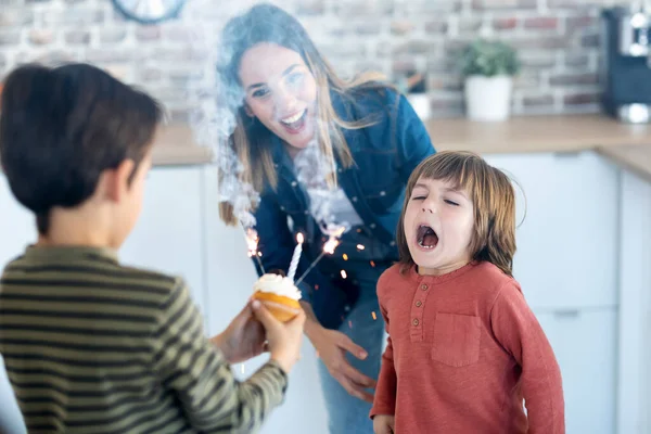 Shot Funny Boy Blowing Out Candles His Birthday Cake While — Stock Photo, Image