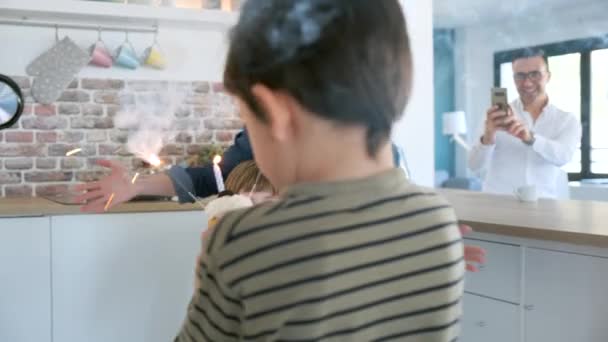 Video Chico Divertido Soplando Las Velas Pastel Cumpleaños Con Madre — Vídeos de Stock