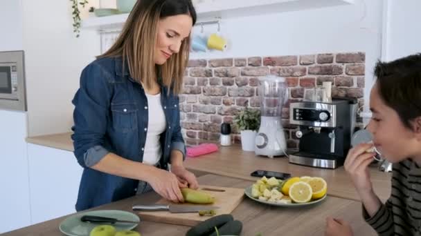 Video Pretty Mother Talking Her Son While Preparing Fruit Plate — Stock Video