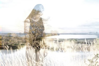 Double exposure of sad young woman with depression over lake landscape background. Introspective and mindfulness concept. clipart