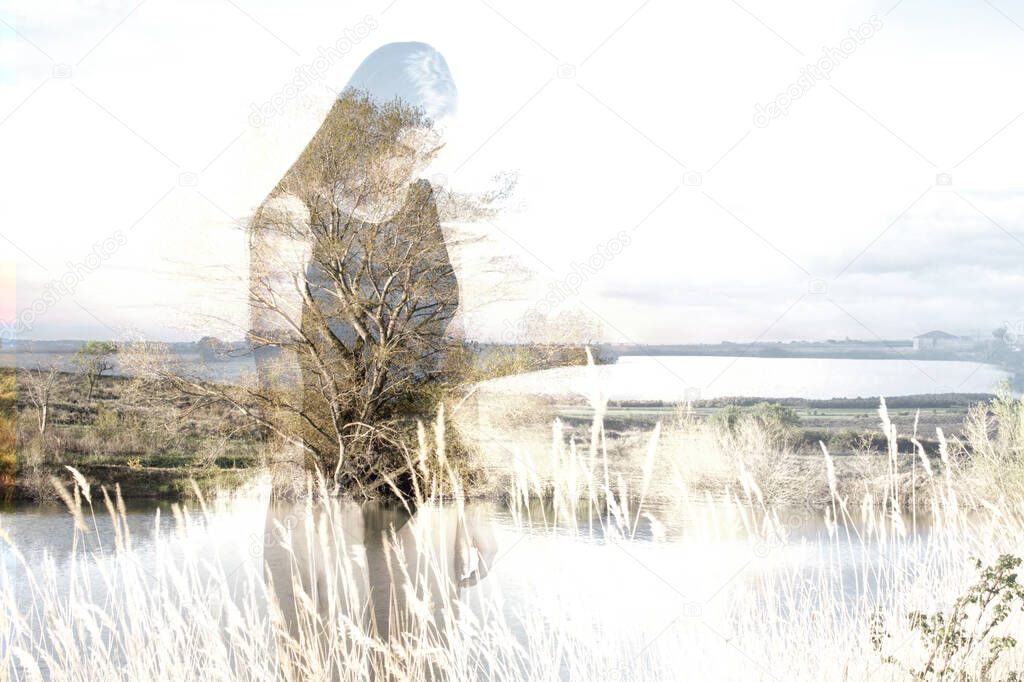 Double exposure of sad young woman with depression over lake landscape background. Introspective and mindfulness concept.