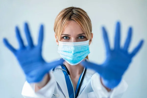 Portrait Female Doctor Medical Mask Showing Hands Camera While Wearing — Stock Photo, Image