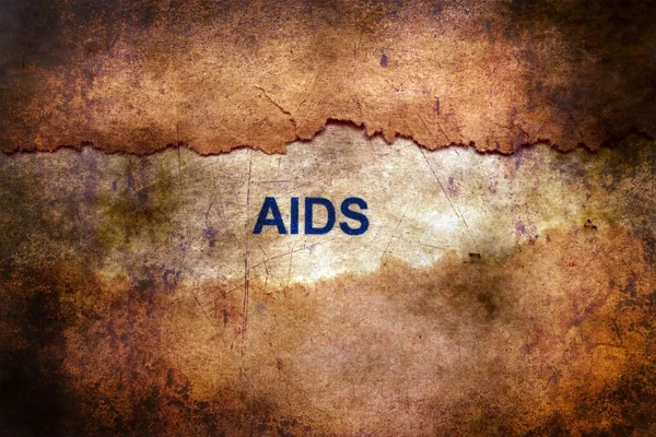 AIDS tekst op gescheurd papier grunge concept — Stockfoto