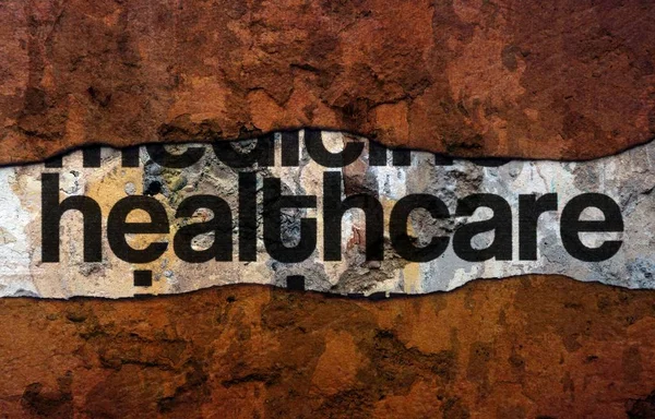 Healthcare text on wall — Stock Photo, Image