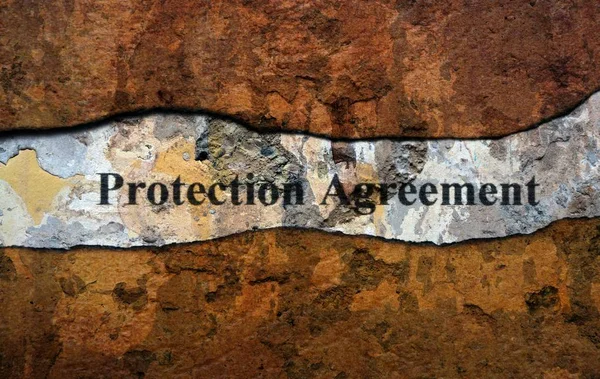 Protection agreement text on wall — Stock Photo, Image