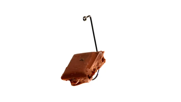 Chocolate On A Fishing Hook Isolated On White Background — Stock Photo, Image