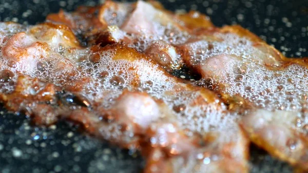 Close-up of a Bacon Fried On Grill — Stok Foto