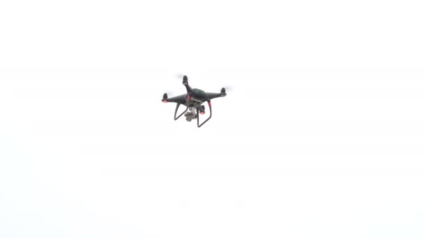 Drone flying aganst white background — Stock Video