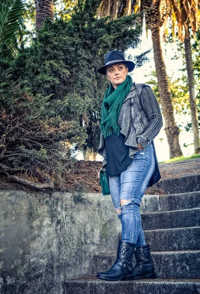 Woman walks down steps Stock Image