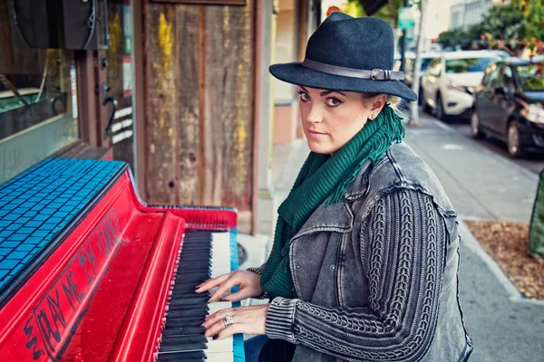 Woman Plays Piano Outside Stock Picture