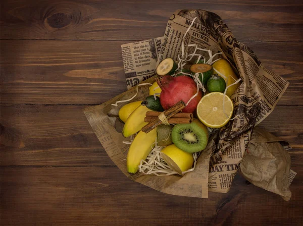 Fruit bouquet on wooden background