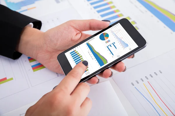 Businesswoman Analyzing Financial Graphs — Stock Photo, Image