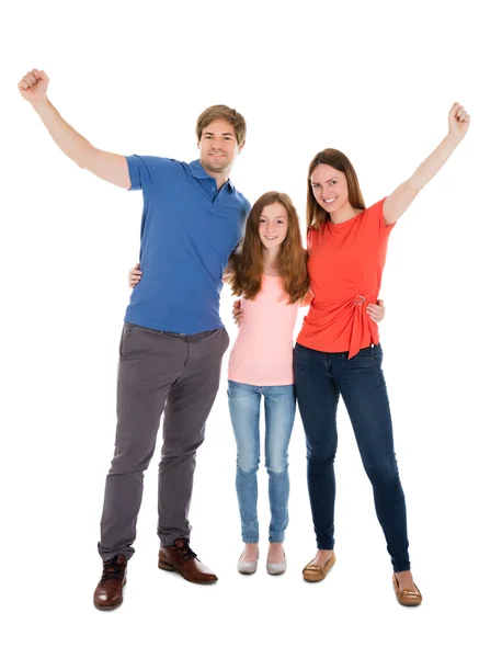 Família feliz levantando seus braços — Fotografia de Stock