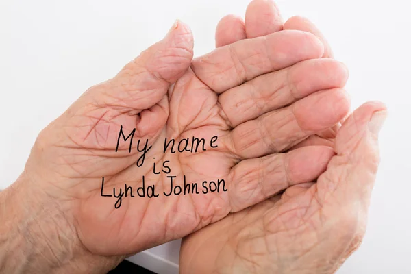 Hand Of A Dementia With Her Name — Stock Photo, Image
