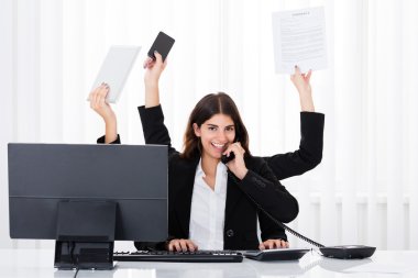 Busy Businesswoman Multitasking clipart