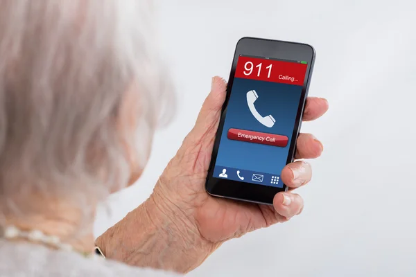 Senior Woman Dialing Emergency Call — Stock Photo, Image