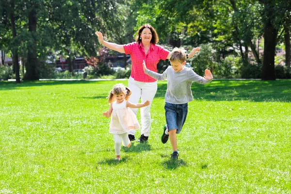 Grandmother And Grandchildren Running — Stock Image Grandmother And Grandchildren Running Stock Photo