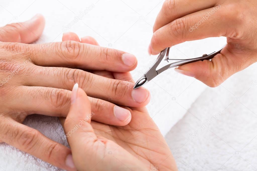 Manicurist doing manicure
