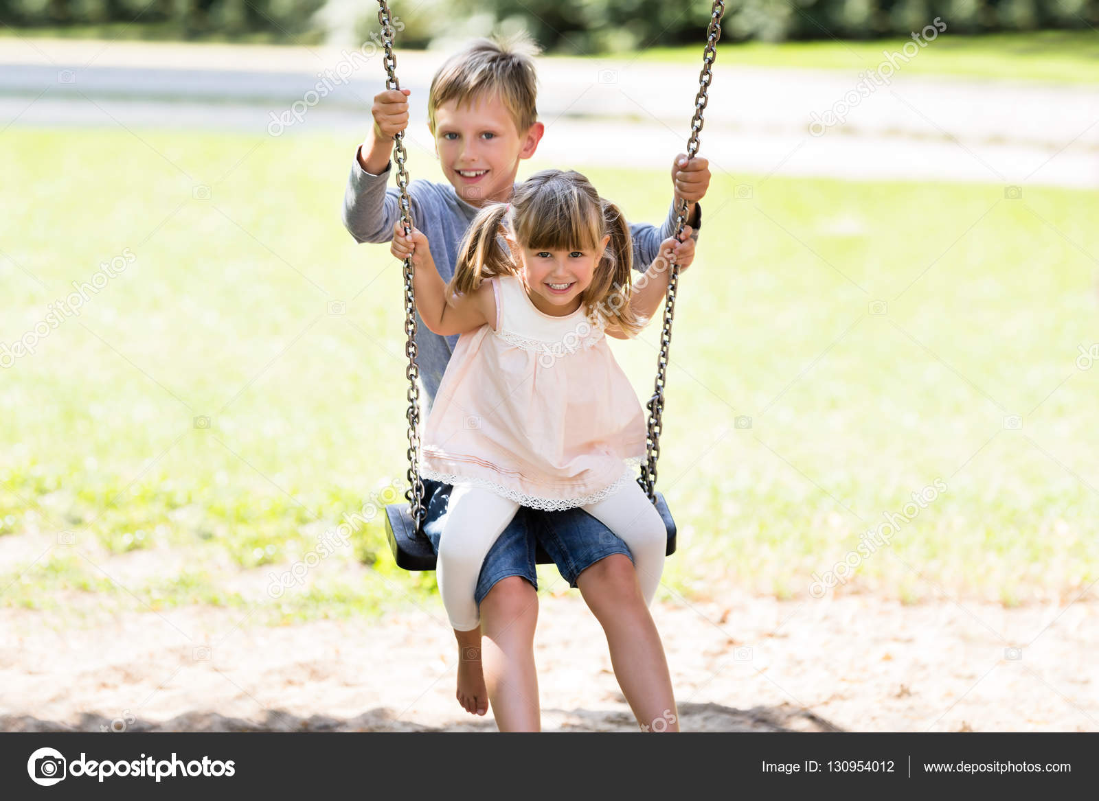 two children on swing