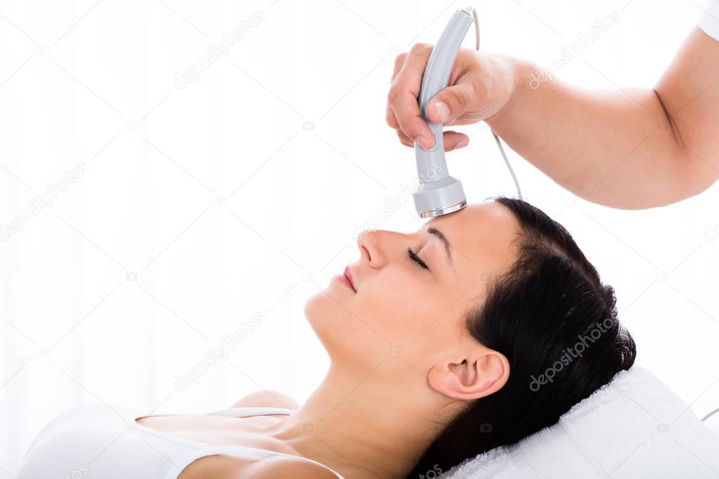 Woman Receiving Microdermabrasion Therapy
