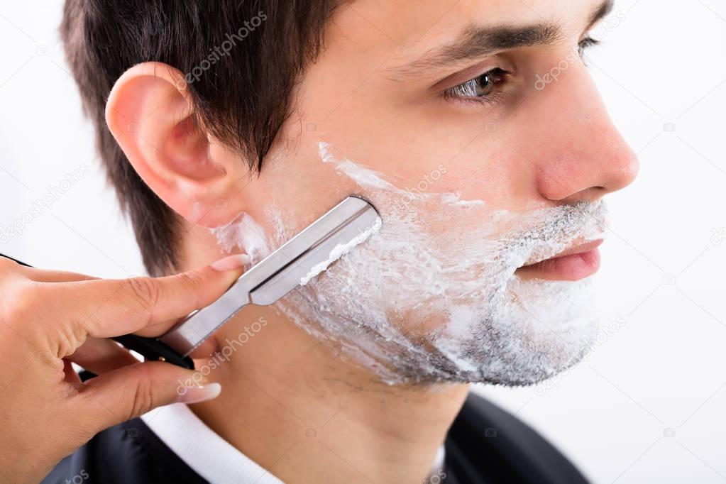 Hairdresser Shaving Man's Beard 