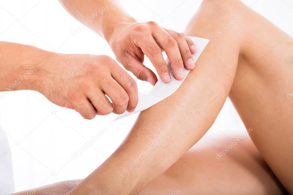 Beautician Waxing Woman Leg