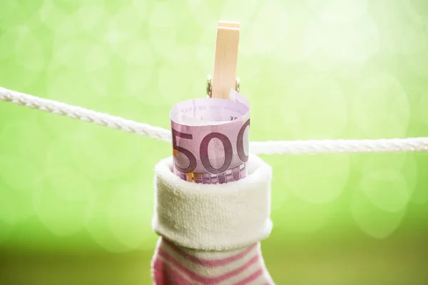 Calcetín de bebé con billete en euros —  Fotos de Stock