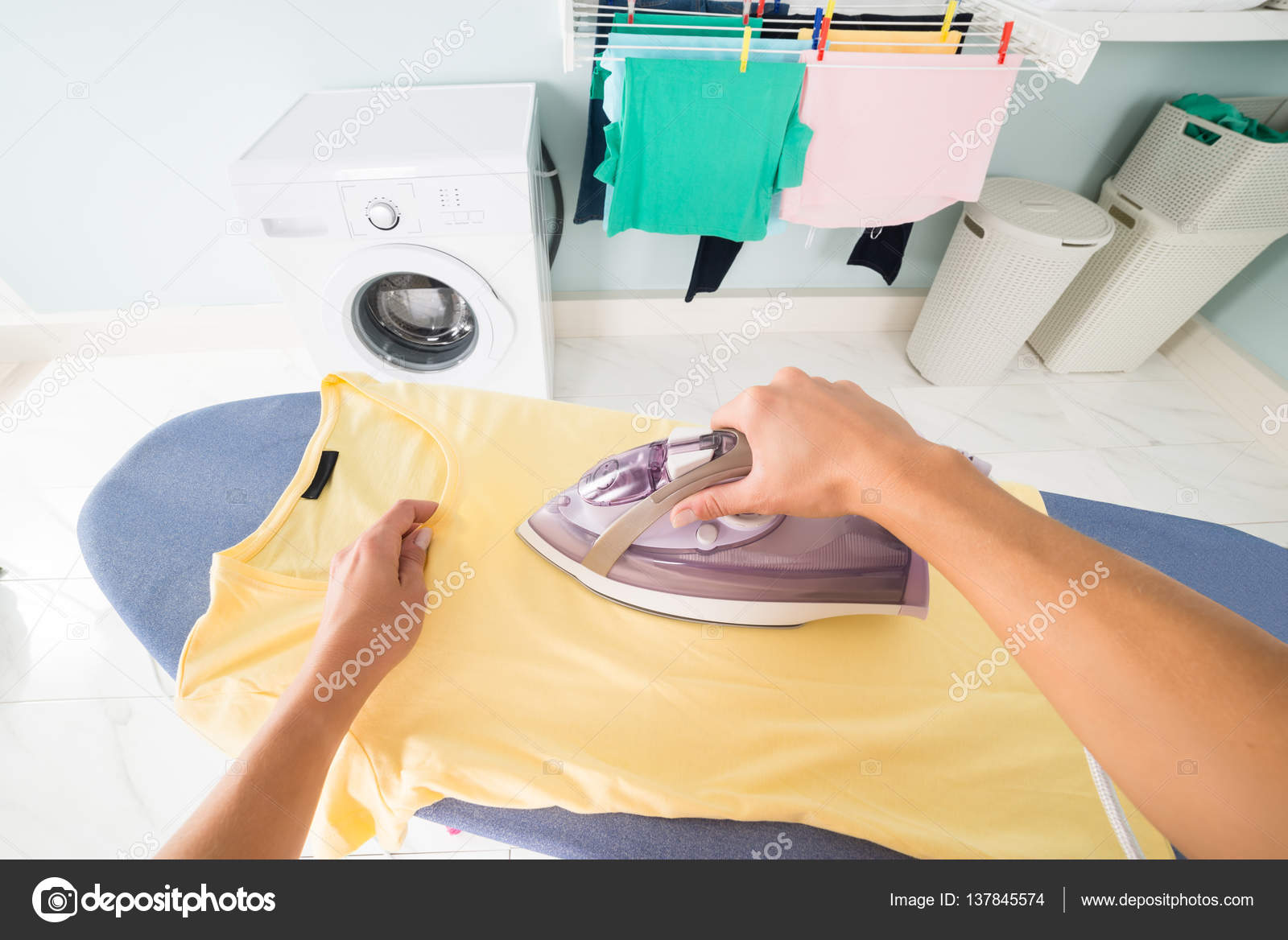 Woman Ironing Tshirt ⬇ Stock Photo, Image by © AndreyPopov 137845574