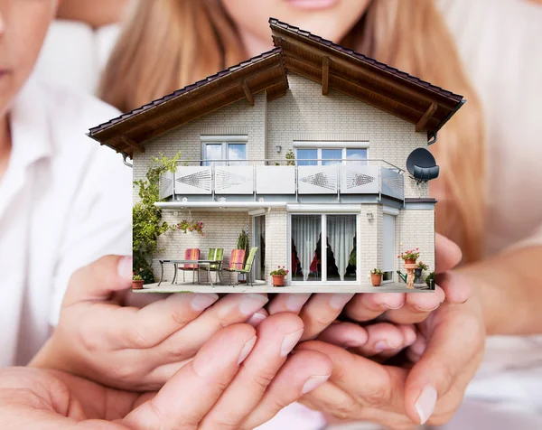 Family Holding House Model — Stock Photo, Image