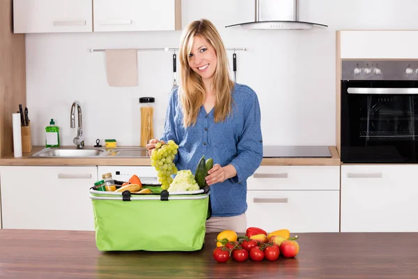 Smiling Woman Removing Grapes — Stock Photo, Image