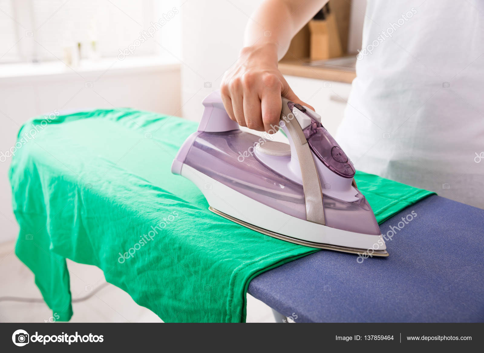 Woman Ironing Tshirt Stock Photo by ©AndreyPopov 137859464