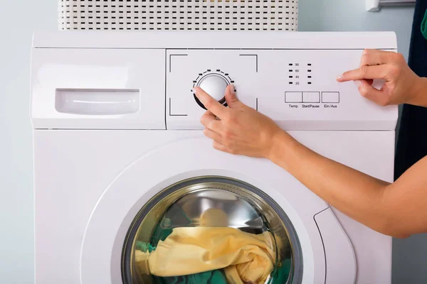 Person Pressing Button Of Washing Machine — Stock Photo, Image