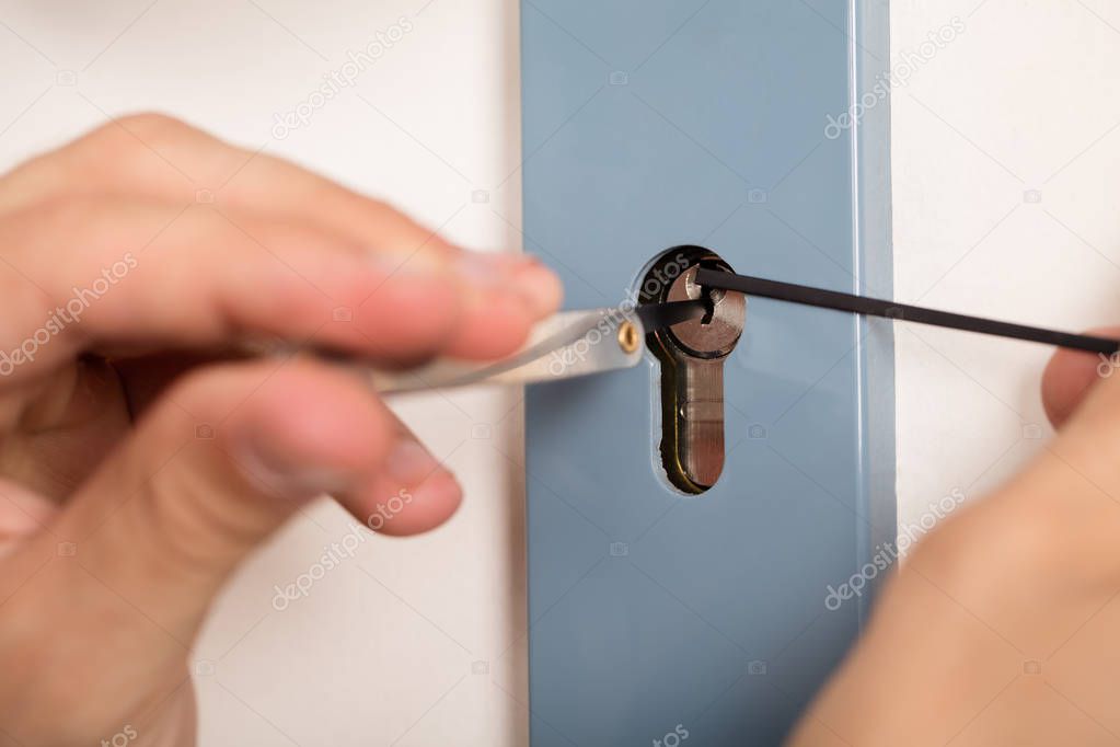 Lockpicker Opening Door Lock