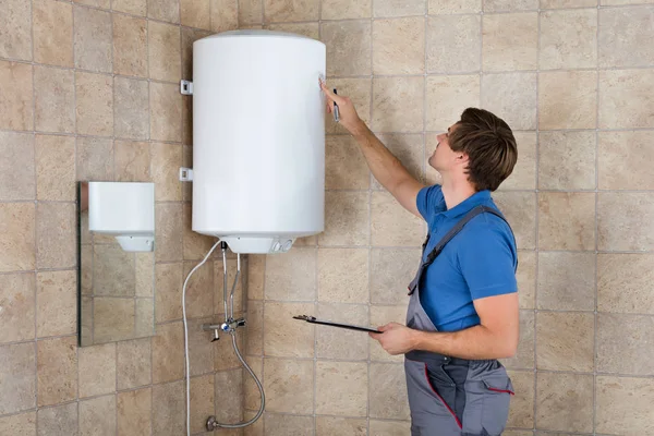 Plumber Checking Electric Boiler — Stock Photo, Image