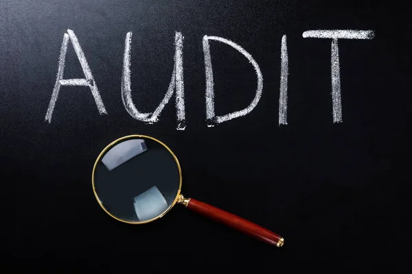 Audit Concept With Magnifying Glass — Stock Photo, Image