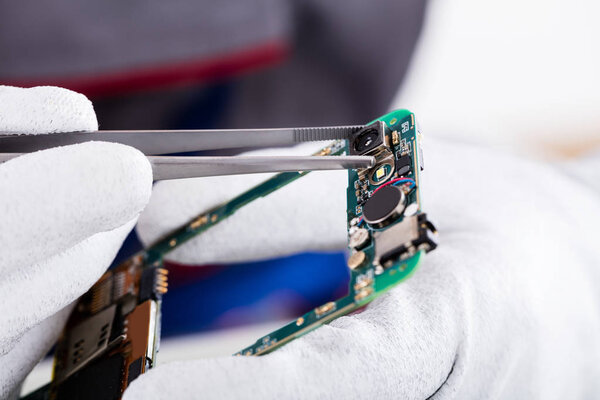 Technician Repairing Phone
