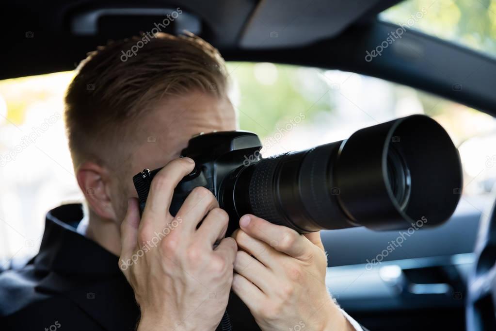 Man Photographing With Camera