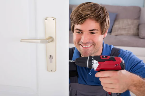 Carpenter Installing Door Lock — Stock Photo, Image