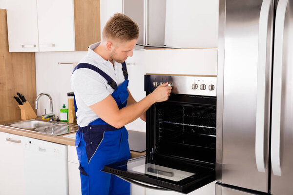 Technician Checking Oven