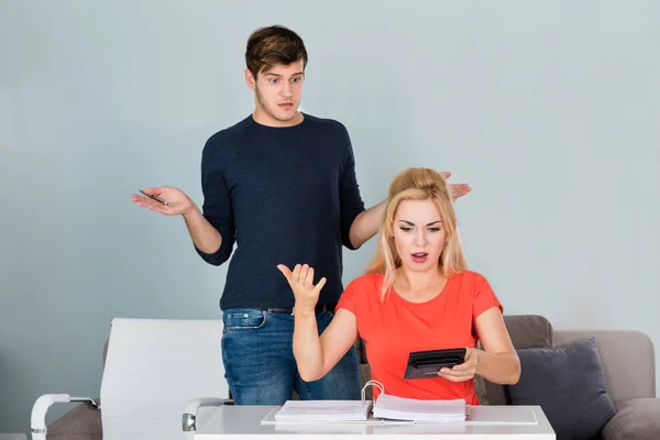 Couple Looking At Bills — Stockfoto