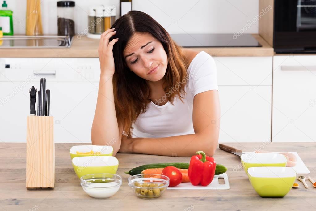 Unhappy Woman In Kitchen