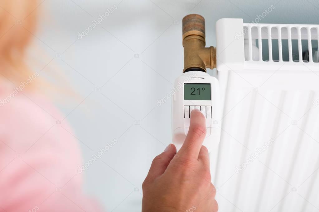 Person Adjusting Temperature