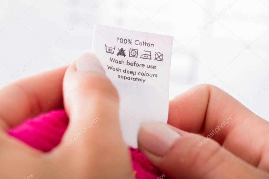 Person Reading Clothing Label