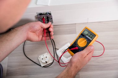 Person Holding Multimeter