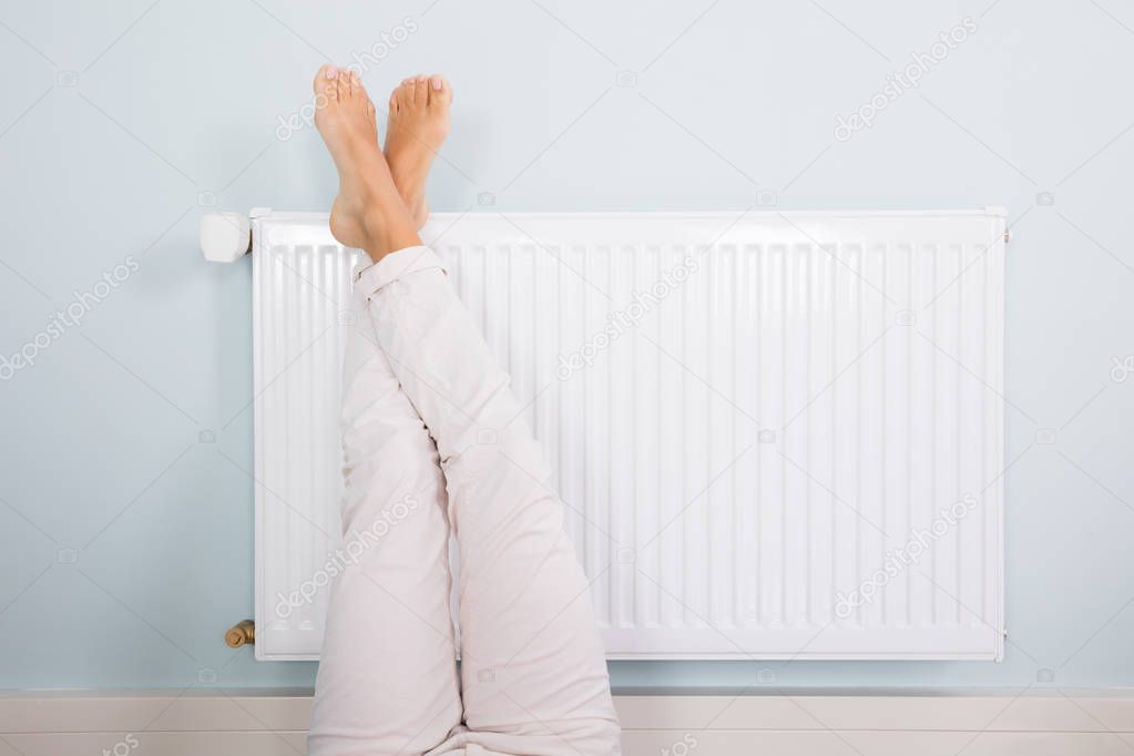 Woman Warming Up Feet 
