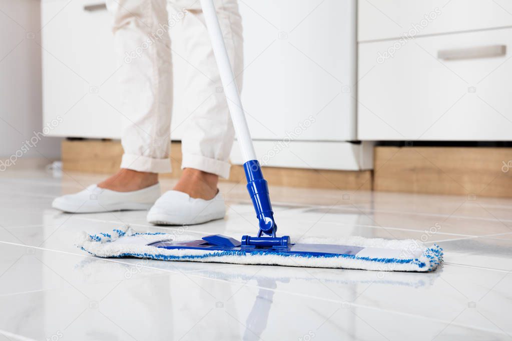 Woman Mopping Floor 