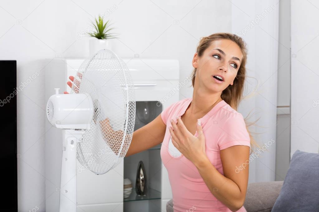 Woman Cooling Herself 