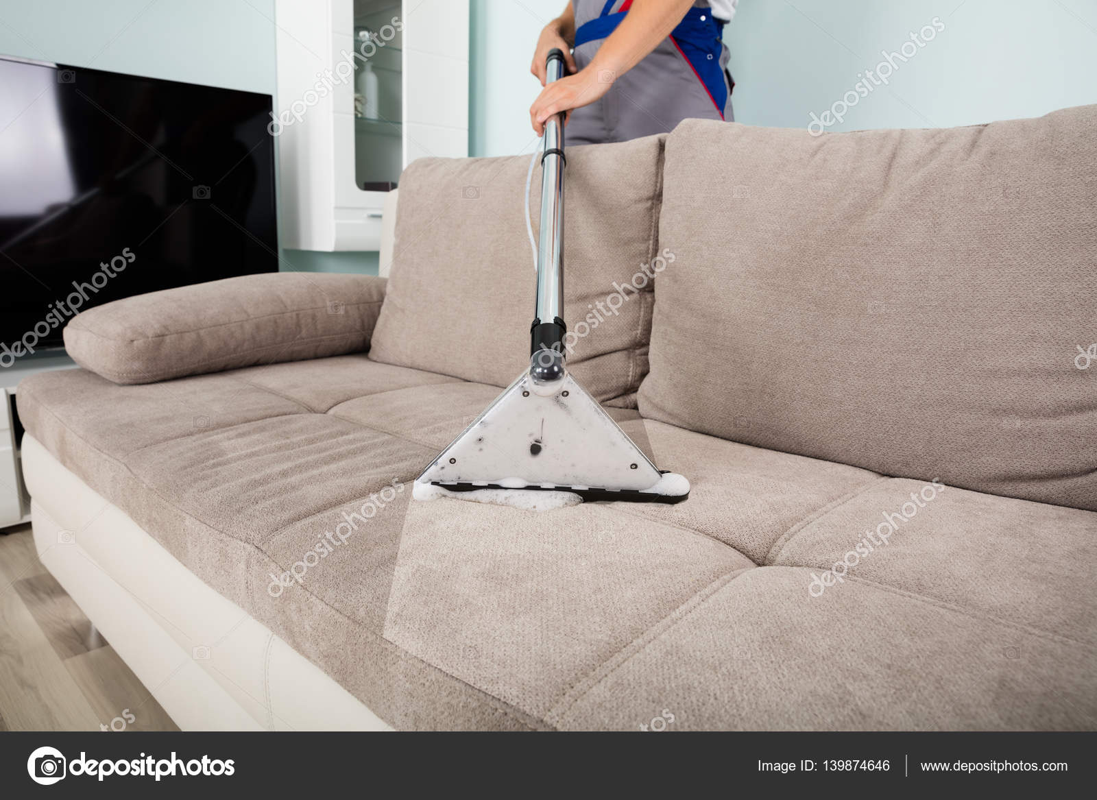Man Cleaning Sofa Stock Photo by ©AndreyPopov 139874646