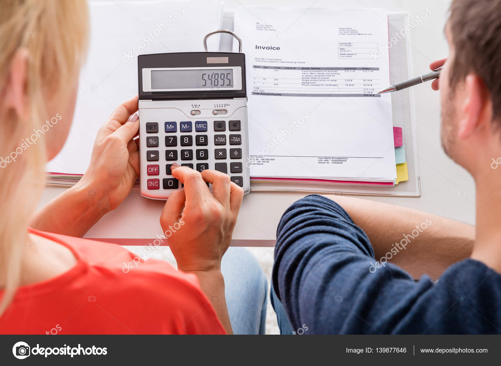 Couple Using Calculator — Stock Photo © AndreyPopov 139877646